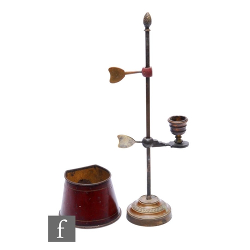 251 - A small 19th Century brass chamberstick fitted with a single sconce and red toleware shade on a matc... 