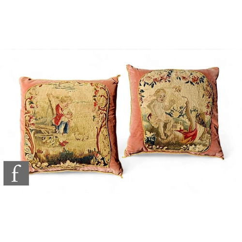 253 - A pink cushion with gold coloured braided edge mounted with a 19th Century needlework panel of two c... 