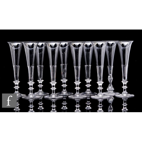 738 - A set of ten 19th Century clear crystal glass champagne flutes, the tall slender drawn trumpet bowl ... 