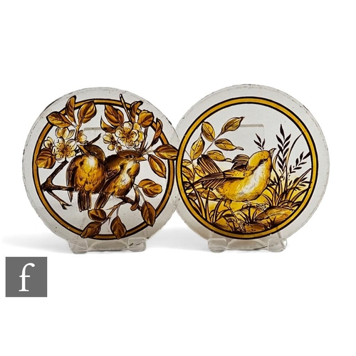 781 - A pair of 19th Century stained glass roundels, each hand enamelled with scenes of wild birds, one to... 