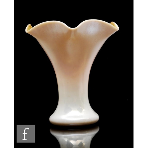 841 - A late 19th Century Steuben vase, the cushion foot rising to a waisted body and wide flared wave rim... 