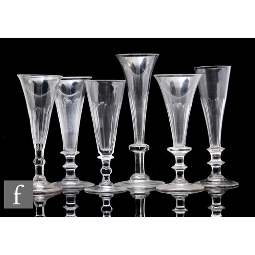 880 - A mixed collection of 19th Century Champagne glasses each with slender trumpet bowls with basal slic... 