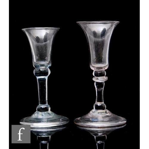 885 - An 18th Century baluster gin glass circa 1740, the slender trumpet bowl above an upper basal knop, p... 