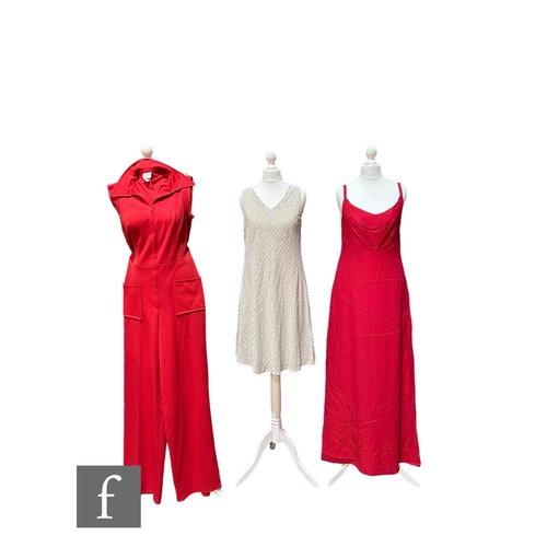 46 - Two 1970s vintage dresses, to include a deep green jersey with balloon sleeves, vertical panel of co... 