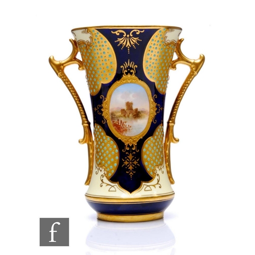 514 - A Coalport 'Jewelled' porcelain vase, circa 1900, of waisted form, flanked by twin solid gilt handle... 