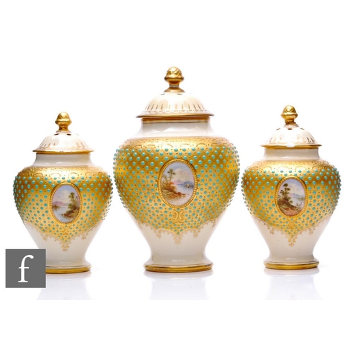 516 - A garniture of Coalport porcelain 'Scottish Loch' pot pourri jars and covers, circa 1900, all with a... 