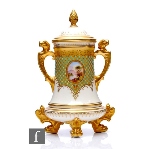 524 - A Coalport porcelain 'Jewelled' vase and cover, circa 1900, raised on gilt paw feet surmounted with ... 