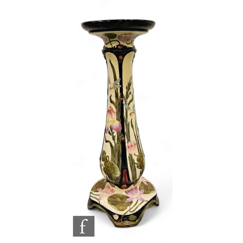 531 - An early 20th Century English tubeline decorated jardiniere stand of swept form rising to a pedestal... 