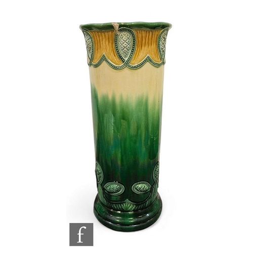 532 - An early 20th Century Minton tubeline decorated stick stand, the variegated yellow to green ground, ... 