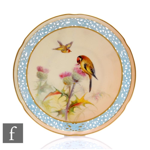 535 - A 19th Century Worcester Grainger reticulated cabinet plate, painted to the field with a bird perche... 