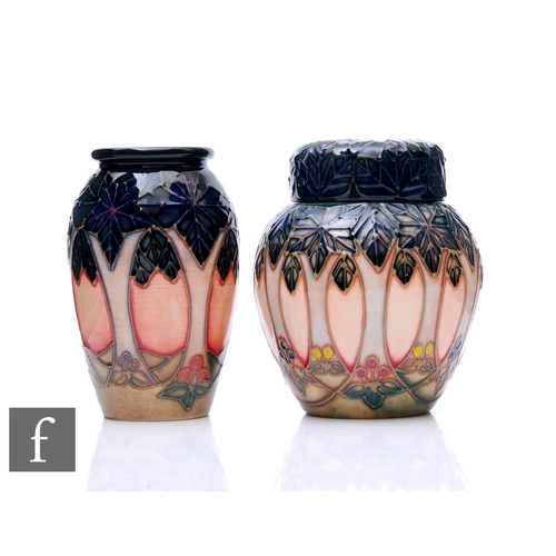 542 - Two Moorcroft pottery Cluny pattern items, to include a ginger jar and vase, heights 11cm. (2)