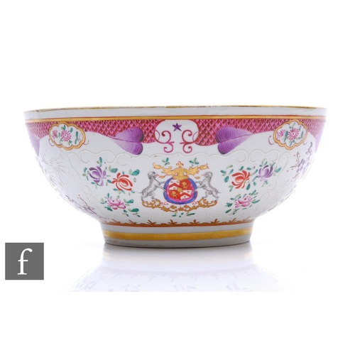 557 - A Samson Armorial punch bowl, of circular form with famille rose decoration and central en grisaille... 