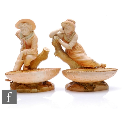 576 - A pair of late 19th century Royal Worcester Hadley blush ivory porcelain figural comports, models 11... 