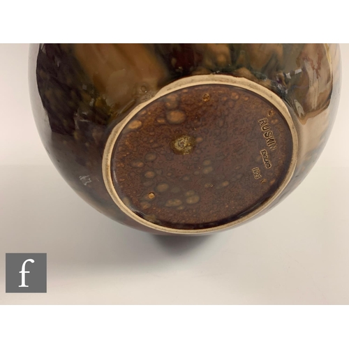 558 - A Ruskin treacle glazed jardinere, of ovoid form with everted rim, glazed throughout with rich mottl... 