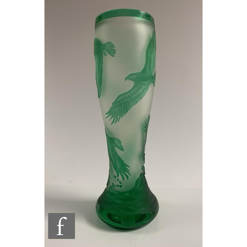 651 - A later 20th Century cameo glass vase of footed swollen sleeve form, cased in green over clear cryst... 