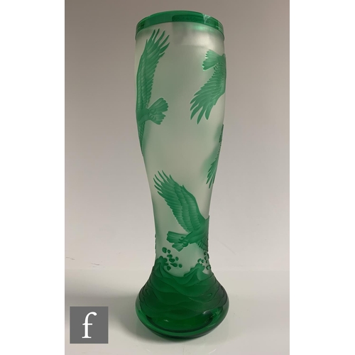 651 - A later 20th Century cameo glass vase of footed swollen sleeve form, cased in green over clear cryst... 