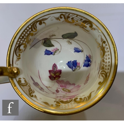 477 - A Coalport porcelain teacup and saucer, painted by William Pollard, circa 1820, painted with bluebel... 