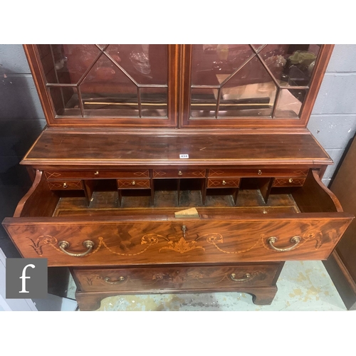 434 - A George III mahogany and inlaid secretaire bookcase, the mahogany and boxwood strung base, inlaid w... 