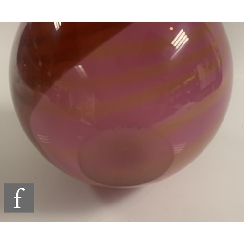 722 - A Peter Layton Pink Paradiso hand blown and cased body vase of spherical form with narrow circular a... 