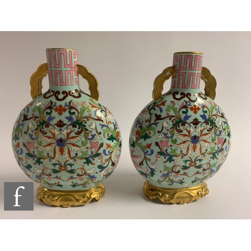 500 - A pair of late 19th Century Worcester moonflasks, each of flattened circular from, the upright neck ... 