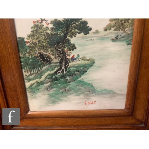 75 - A pair of Chinese late Qing Dynasty/Republic period framed porcelain plaques, each painted in famill... 