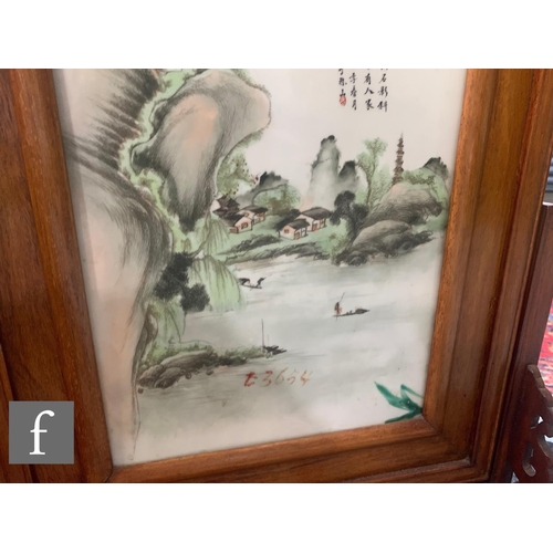 75 - A pair of Chinese late Qing Dynasty/Republic period framed porcelain plaques, each painted in famill... 