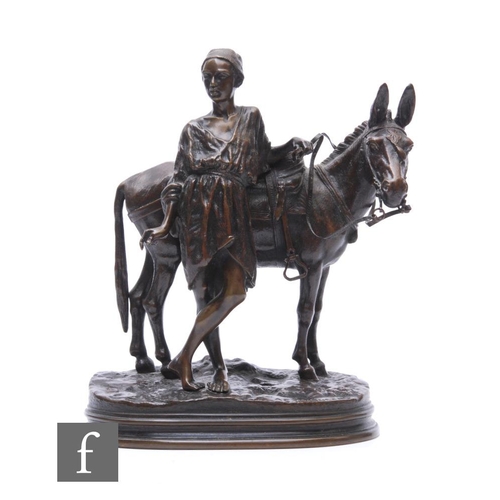 249 - A bronze sculpture by Alfred Dubucand (1828-1894), depicting an Egyptian standing with a mule, on ov... 