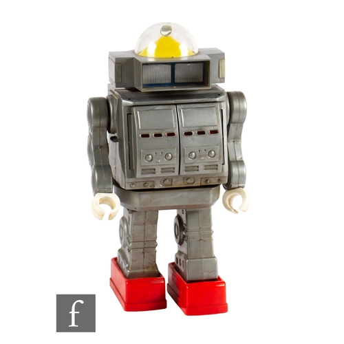 35 - A 1970s Mego/Horikawa Giant Robot, battery operated plastic robot in grey with red feet, opening che... 