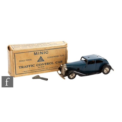 39 - A Triang Minic Vauxhall Traffic Control Car, in dark blue and black with two policeman figures, lack... 