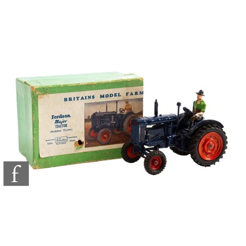 50 - A Britains Farm Series 128F Fordson Major Tractor with dark blue body, orange wheels and black rubbe... 