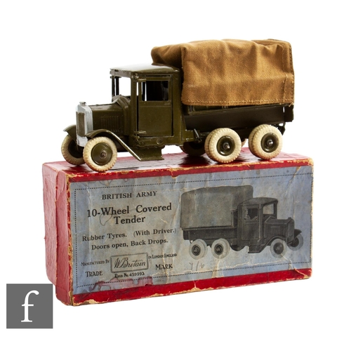 53 - A Britains 1432 10-wheeled Covered Tender, in military green, with canvas tilt, driver, and white ru... 