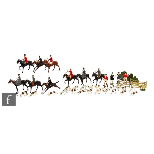 99 - A Britains Hunt set to include nine riders, four huntsman, twenty one hounds and a fox, also two swi... 