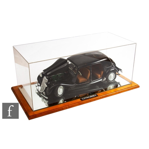 412 - A 1/24 scale model of a Citroen 15 Traction Avant, black by Heller model kits, bonnet open revealing... 