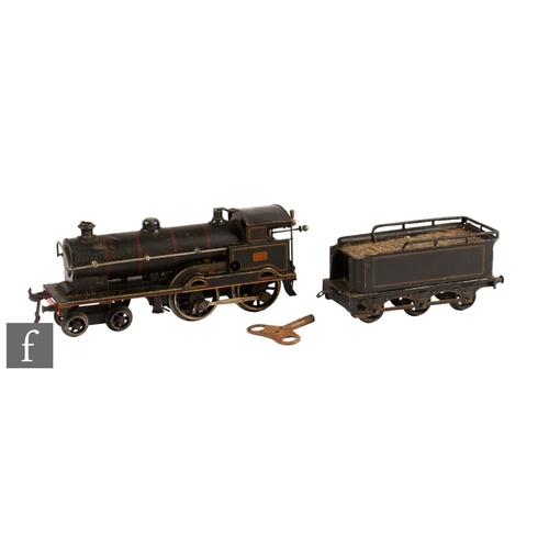 10 - An O gauge Bing 4-4-0 black George the Fifth clockwork locomotive and tender.