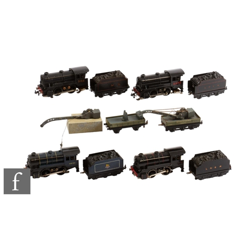 24 - A collection of OO gauge Trix model railway, to include four tank locomotives and various tenders.