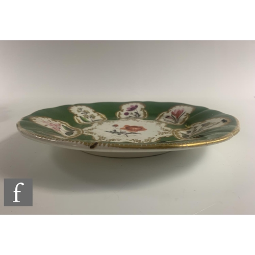 470 - A collection of 19th Century Coalport dishes, all decorated with botanical designs, with green and i... 