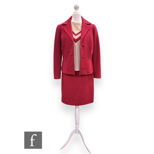 21 - A 1960s vintage red three piece suit, comprising structured jacket with button fastening, pencil ski... 