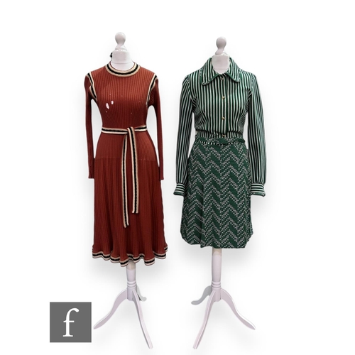 23 - A 1970s vintage Jersey Ware knitted dress with long sleeves, button up detail to the green, black an... 