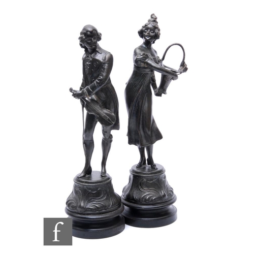 234 - A pair of 19th Century French spelter figures of a lady with a basket and her suitor with a violin, ... 