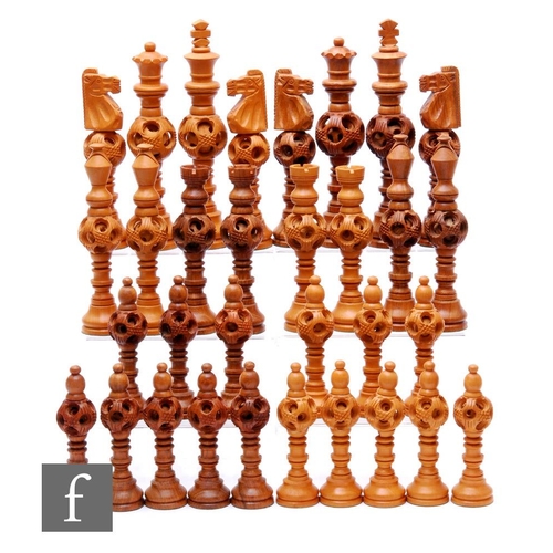 216 - A 1970s Jordanian carved hardwood chess set of turned and concentric centre ball design, height 20cm... 