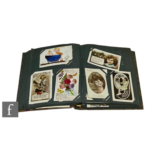 145 - A 1920s and later postcard album containing birthday, greetings, comical and humour etc. (qty)