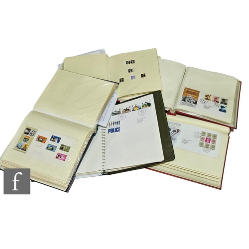 121 - A large of collection of British first day covers contained in five albums, also some mounted mint s... 