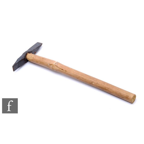 264 - A geologist's rock hammer, spike and chisel double end, later wood handle, length 39cm.