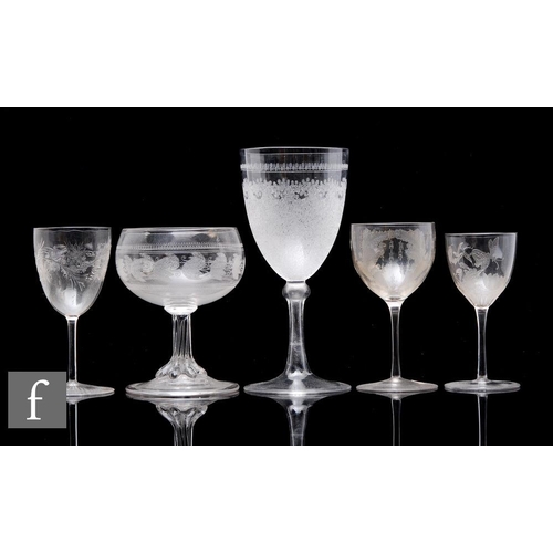 864 - A 19th Century Stourbridge clear crystal wine glass, the pointed round funnel bowl with a rolling wa... 