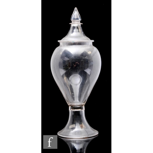 859 - A 19th Century clear crystal glass Leech jar of shouldered ovoid form with a swept and folded foot, ... 