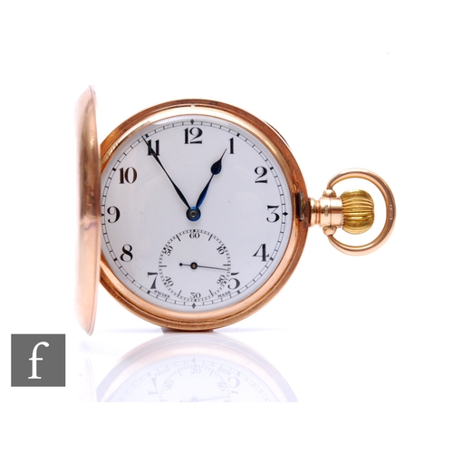 199 - A 9ct hallmarked crown wind full hunter pocket watch, Arabic numerals to a white enamelled dial, cas... 