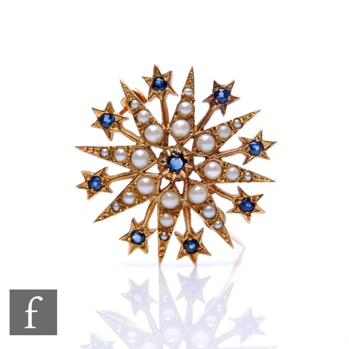 100 - A 9ct hallmarked sapphire and seed pearl set star brooch, weight 7g, diameter 30mm.