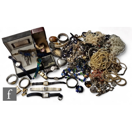 102 - A parcel lot of assorted costume and other jewellery to include beads, brooches, watches, chains, pe... 