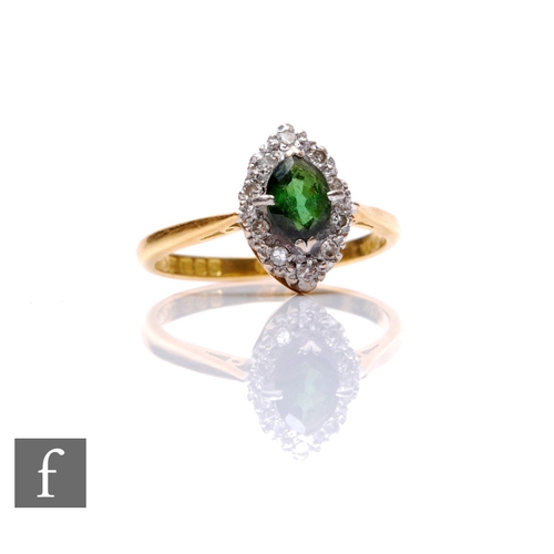 123 - An 18ct hallmarked green garnet and diamond marquise shaped ring, central garnet within diamond set ... 