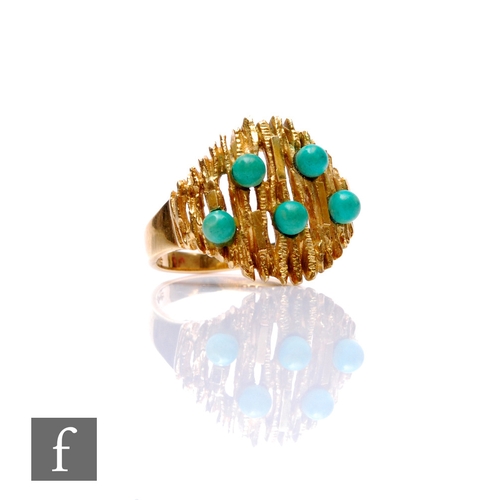 128 - A mid 20th Century 14ct five stone turquoise ring, beads stones set to a pierced bark effect head, w... 